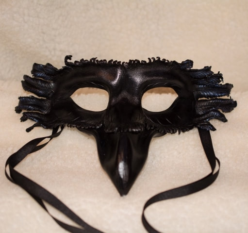 Handmade leather raven costume mask with ribbon ties. Hand molded and hand painted. All black with blue highlights on the side feathers.