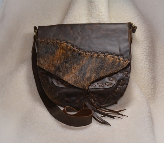 Brown leather two tone shoulder bag with hair-on hide embellishment
