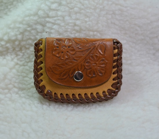 2 pocket deerskin coin pouch with leather lace edging, single snap closure, carved double flower