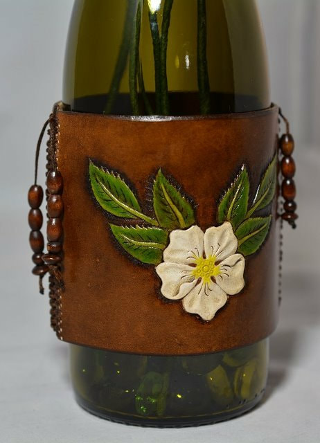 Hand Painted Carving of a Wild Rose on a Leather Wine Bottle Cover