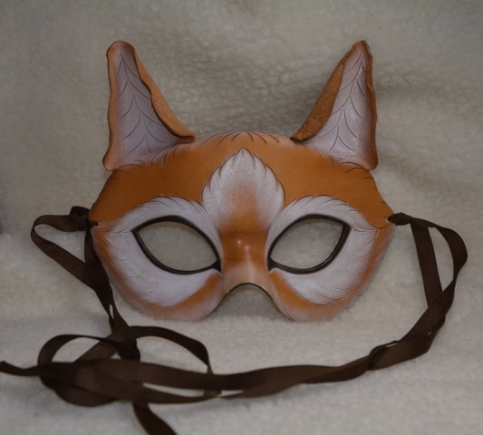 Handmade leather cat costume mask with ribbon ties. Hand molded and hand painted. Orange and tan with white fur highlights