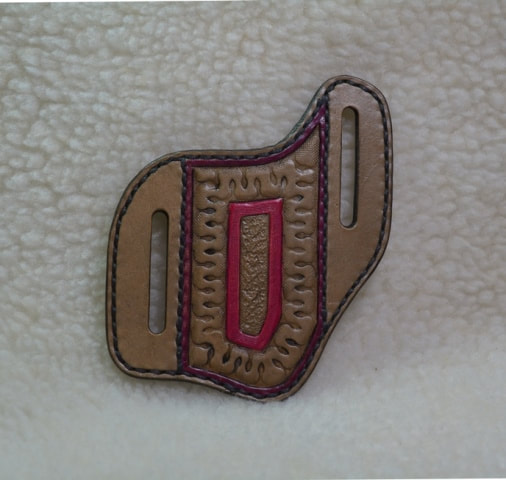 Leather Belt Slide Pocket Knife Sheath Pouch (front view) - 2 inch pouch width - Smoke (brownish-black) and fuchsia colors with a stamped serpentine design